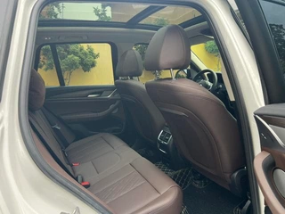 BMW X3 2022 xDrive30i Leading Type M Obsidian Night Suit interior photo 12