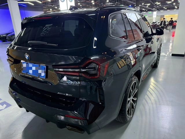 BMW X3 2022 xDrive30i Premium Class M Obsidian Night Suit interior photo 9