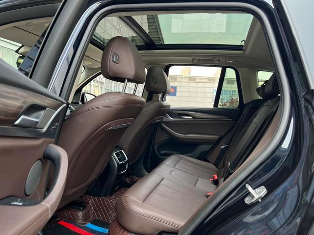 BMW X3 2022 xDrive30i Leading Type M Obsidian Night Suit interior photo 12