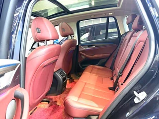 BMW X3 2022 xDrive30i Leading Type M Obsidian Night Suit interior photo 8
