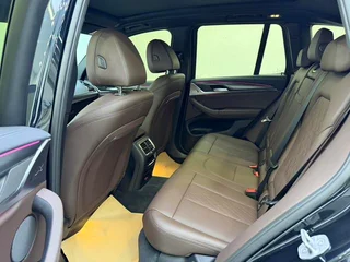 BMW X3 2022 xDrive30i Premium Class M Obsidian Night Suit interior photo 8