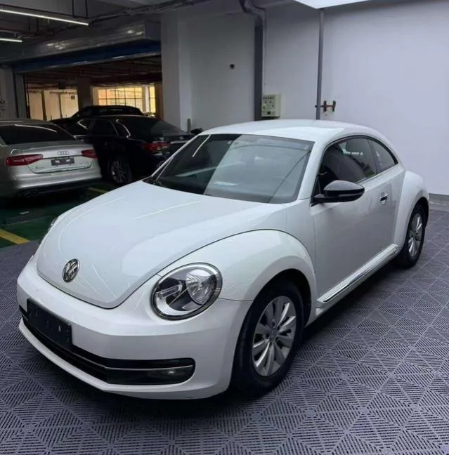 Volkswagen Beetle 2014 1.2TSI Fashionable exterior photo 1 Volkswagen Beetle 2014 1.2TSI Fashionable exterior photo 1