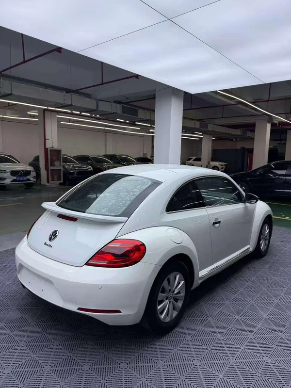 Volkswagen Beetle 2014 1.2TSI Fashionable exterior photo 4 Volkswagen Beetle 2014 1.2TSI Fashionable exterior photo 4