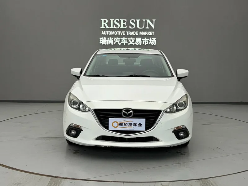 Mazda Mazda3 Axela 2014 Трёхобъёмный 1.5L Автоматическая люксовая модель экстерьер фото 2 Mazda Mazda3 Axela 2014 Трёхобъёмный 1.5L Автоматическая люксовая модель экстерьер фото 2