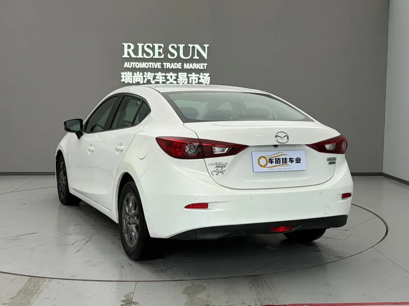 Mazda Mazda3 Axela 2014 Трёхобъёмный 1.5L Автоматическая люксовая модель экстерьер фото 4 Mazda Mazda3 Axela 2014 Трёхобъёмный 1.5L Автоматическая люксовая модель экстерьер фото 4
