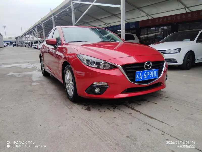 Mazda Mazda3 Axela 2016 Трёхобъёмный 1.5L Автоматическая люксовая модель экстерьер фото 3 Mazda Mazda3 Axela 2016 Трёхобъёмный 1.5L Автоматическая люксовая модель экстерьер фото 3